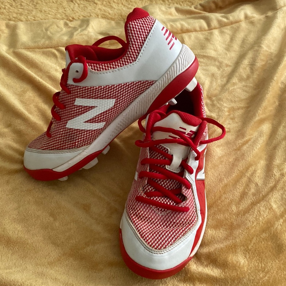Boys size 5 New Balance Cleats. Red and white